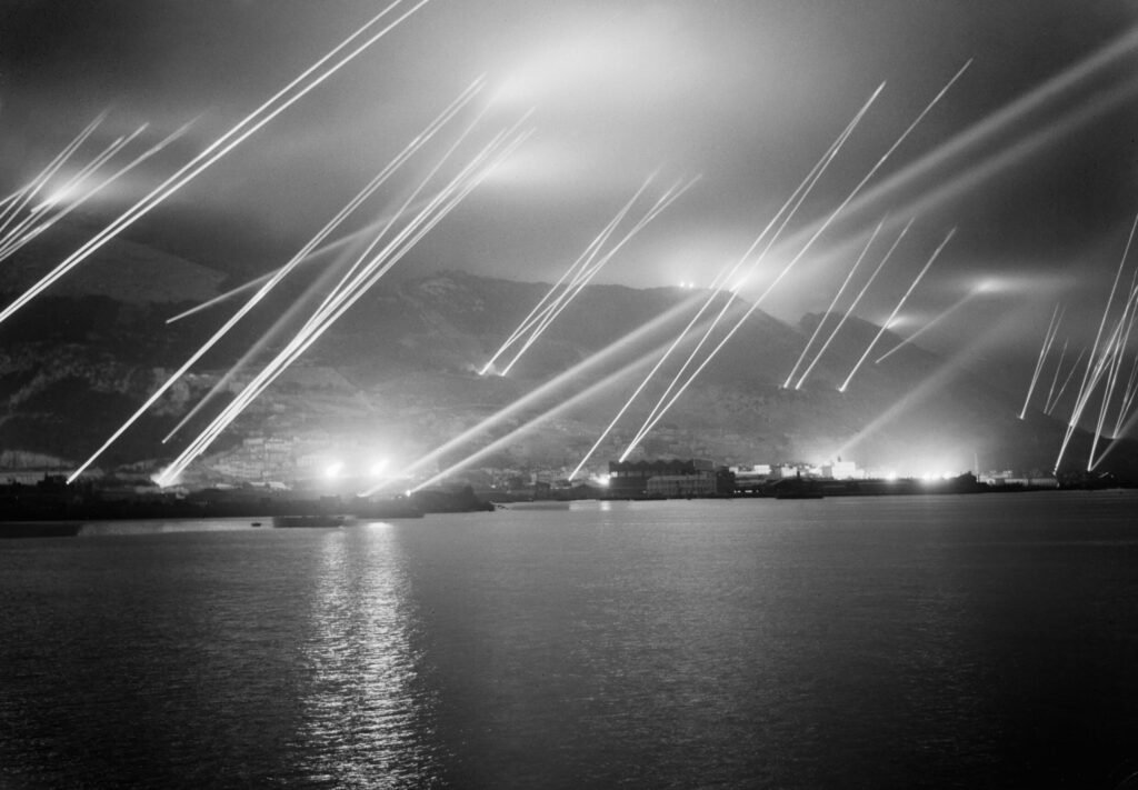 Searchlights in the night sky during an air-raid practice on Gibraltar, 20 November 1942
